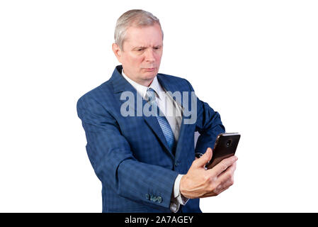 An elderly man communicates via video communication. Isolated on a white background. Stock Photo