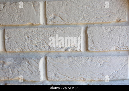 Fragment of white wall decorative brickwork for graphics and texture Stock Photo