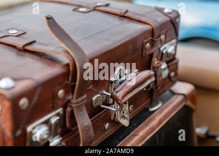 Macro view of Vintage leather suitcase with chrome clasps Stock Photo