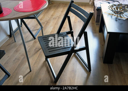 Wooden seats with cheap table in middle