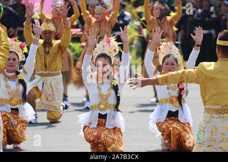 A number of dancers are performing traditional Indonesian dances at cultural activities Stock Photo