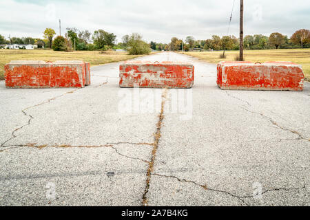 Heavy concrete roadblocks blocking highway or street. Obstacle, dead ...