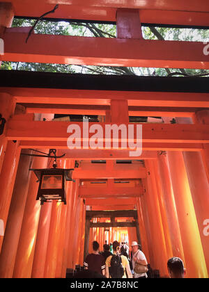 The torii gates of Fushimi Inari Taisha, Japan.  Fushimi Inari-taisha (伏見稲荷大社) is the head shrine of the kami Inari, located in Fushimi-ku, Kyoto. Stock Photo