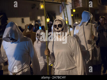 A Group Of People Dressed Up As Monks Walk Along The Street While Holding Candles During The Vi Edition Of Churriana Noche Del Terror Churriana Horror Night To Celebrate The Halloween Night