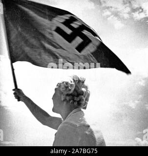 Eva Braun Collection (Album 2) - Woman waving Nazi flag ca. late 1930s or early 1940s Stock Photo