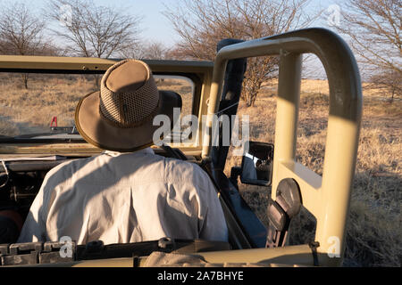 Guide Driving Off-Road, All-Terrain 4WD Vehicle through the African Bush in Makgadikgadi Salt Pan, Botswana, Africa Stock Photo