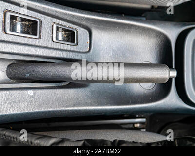 The lever of a manual brake of the car. Place for text. Transport. Stock Photo