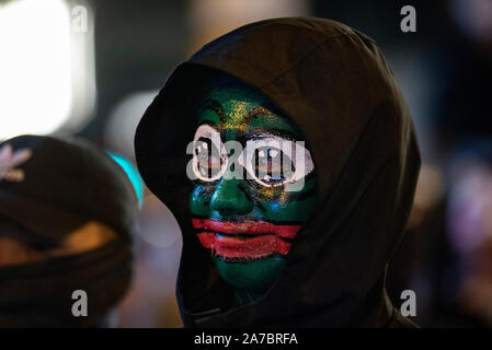 Hong Kong, China. 31st Oct, 2019. A protester wearing face paint of Pepe the frog in Central district, Hong Kong. Protesters at Halloween march in Hong Kong island despite police banned rallies and confront them during the night. Credit: SOPA Images Limited/Alamy Live News Stock Photo