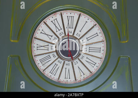Retro clock timepiece . dial, vintage watches. rum clock . Old rusty green big street clock on wall of the building . Stock Photo