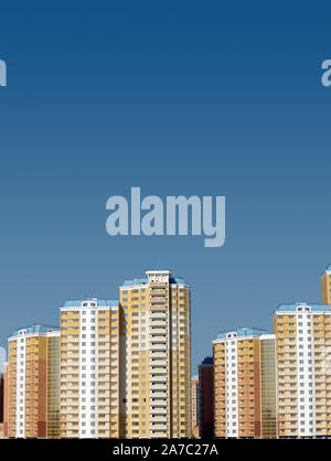 Modern district with constructed buildings on bottom part of the Photo with free space for text above on clear cloudless blue sky Stock Photo