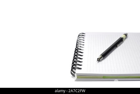 Squared notepad with mechanical pencil isolated on white background with free space for text on left side Stock Photo