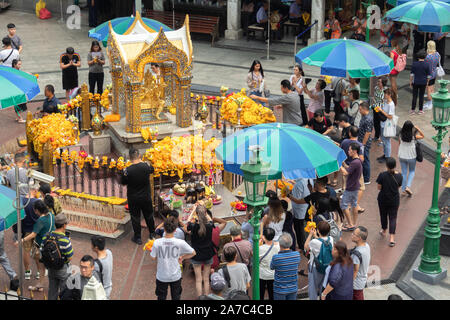 Bangkok, Thailand - October 22, 2019 : unidentified tourists and thai people praying respect the famous Erawan shrine at Ratchaprasong junction, Bangk