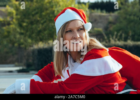 Stock photo of Mama noel placing a ruler in the bag with expression of happiness Stock Photo