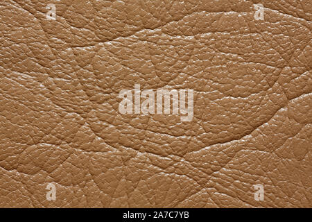 Beige leatherette texture with shiny surface. Superlative dark leatherette texture. Stock Photo