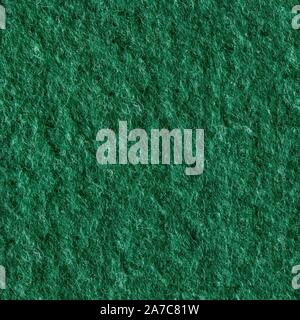 Macro shot of green felt tissue cloth, closeup texture. Seamless square texture. Tile ready. Stock Photo