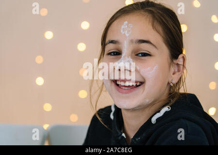 Young kids baking Christmas gingerbread cookies in house kitchen on winter day.Kids playing with flour. Baking and cooking with children for Xmas at h Stock Photo