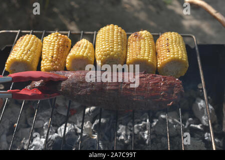 Skert Steak Machete is one of the most delicious and unusual steaks. It is cut from the diaphragm, Cooking corn. Cooking meat on the grill. Skert Stea Stock Photo
