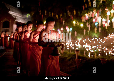 Groups of young Buddhist monks celebrate the Loy Krathong festival at Wat Phan Tao Temple, Chiang Mai, Thailand Stock Photo