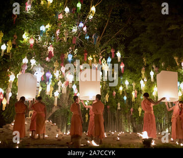 Groups of young Buddhist monks celebrate the Loy Krathong festival at Wat Phan Tao Temple, Chiang Mai, Thailand Stock Photo