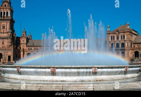 View of Plaza de Espaa in Sevilla with the rainbow in the fountain Stock Photo
