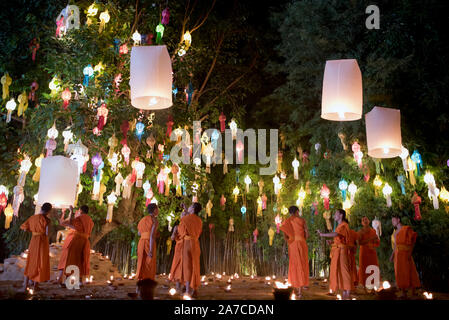 Groups of young Buddhist monks celebrate the Loy Krathong festival at Wat Phan Tao Temple, Chiang Mai, Thailand Stock Photo