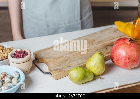 spinach, dried cranberries, goat cheese, walnuts, pear - home salad coocking - cuts ingredients Stock Photo