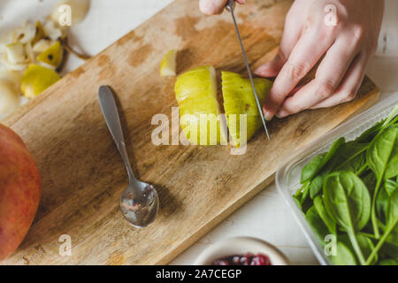 spinach, dried cranberries, goat cheese, walnuts, pear - home salad coocking - cuts ingredients Stock Photo