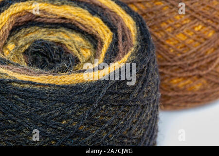 Multicolored skeins of wool yarn. Knitting and crochet. Preparation for autumn-knitting warm clothes. Crafts, hand-made. Stock Photo