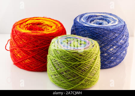 Multicolored skeins of wool yarn. Knitting and crochet. Preparation for autumn-knitting warm clothes. Crafts, hand-made. Stock Photo