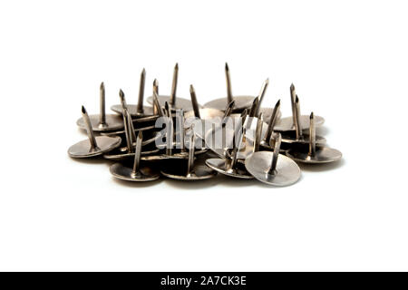 Overturned push pins on a white background Stock Photo