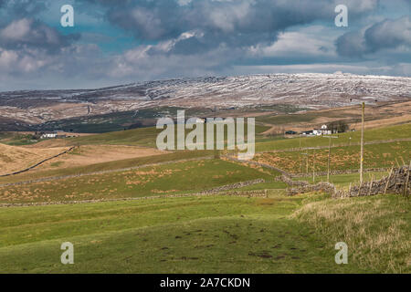 Patches on snow of the higher fells above the remote farming community of Harwood, Upper Teesdale