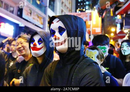 Hong Kong, China. 31st Oct, 2019. Thousands of people wearing masks and costumes marched through Hong Kong's city centre on Halloween night and ended up in the district of Lan Kwai Fong in Central. After midnight clashes broke out and police fired tear gas to clear the streets. Credit: Gonzales Photo/Alamy Live News Stock Photo