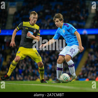29th October 2019, Etihad Stadium, Manchester, England; Carabao Cup, Manchester City v Southampton : Adrian Bernabe (82) of Manchester City is challenged by James Ward-Prowse (16) of Southampton Credit: Conor Molloy/News Images Stock Photo