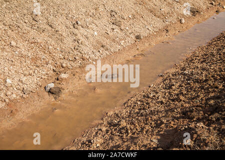 New water catchment canal for agriculture near fields. Stock Photo