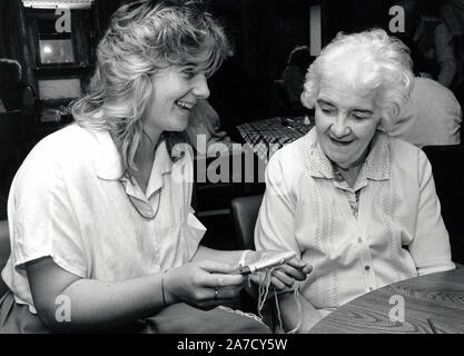 Care worker with elderly woman in residential care home, Nottingham, UK 1987 Stock Photo