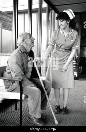 Nurse & elderly man, Queen's Medical Centre hospital, Nottingham March 1989 UK Stock Photo