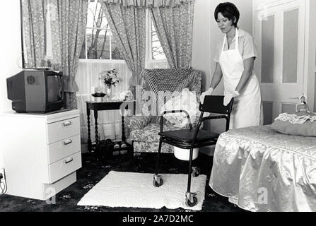 Care worker in residential home for the elderly 1080s/90s UK Stock Photo