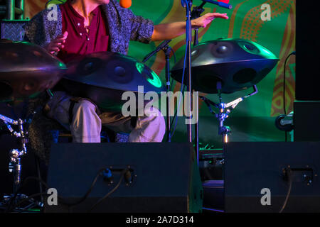 Unrecognizable man playing hang drum Stock Photo