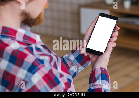 Mockup image - man holding black smartphone with white blank screen Stock Photo