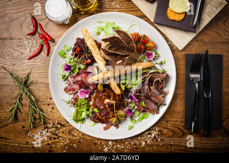 Meat platter for two served on a plate in restaurant Stock Photo