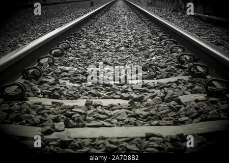 Close-up train rail track in a black and white picture Stock Photo