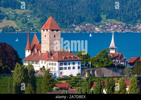 Aerial view of Spiez Church and Castle on the shore of Lake Thun in the Swiss canton of Bern at sunset, Spiez, Switzerland. Stock Photo