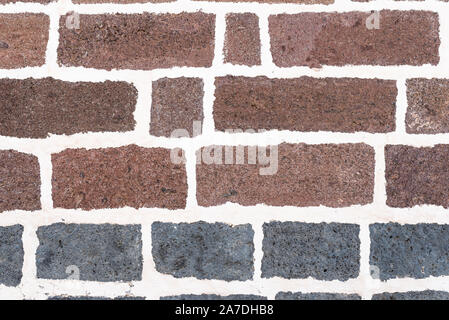old brick wall background with white grout in joints Stock Photo