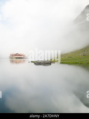 balea chalet near balea lake on transfagarasan road romania in a foggy day Stock Photo