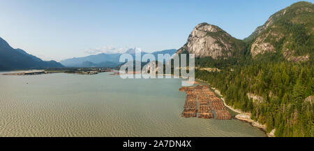 Aerial panoramic view of Sea to Sky Highway with Chief Mountain in the background during a sunny summer day. Taken near Squamish, North of Vancouver, Stock Photo