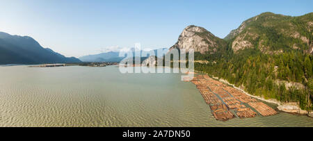 Aerial panoramic view of Sea to Sky Highway with Chief Mountain in the background during a sunny summer day. Taken near Squamish, North of Vancouver, Stock Photo