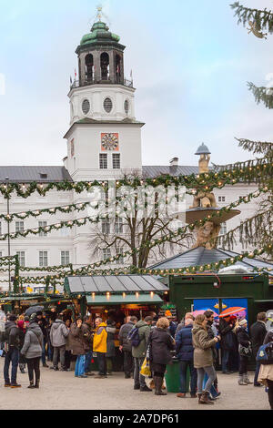 Salzburg, Austria - December 25, 2016: Christmas market with kiosks and stalls, people Stock Photo