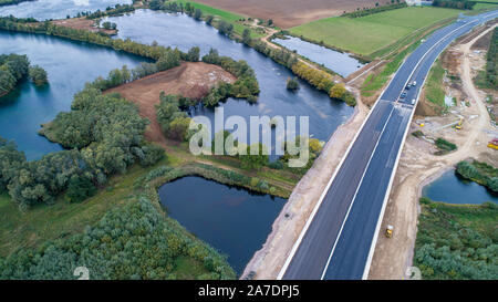 Picture dated October 10th 2019 shows a section of the new A14 near Huntingdon which part of the UKÕs biggest road upgrade and is to be opened a year early.   A new bypass on one of the UKÕs biggest road upgrades costing £1.5 billion is set to be open one year EARLY. The A14 Huntingdon bypass dual carriageway route in Cambridgeshire was not expected to be finished until late 2020, but drivers will be able to use it from this December. The Department for Transport says Highways England has made Òexcellent progressÓ and the 12-mile stretch will be opened ahead of schedule. The full 21-mile proje Stock Photo