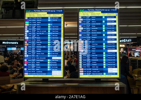 Departure boards with times of scheduled flights at Lisbon airport in Portugal Stock Photo