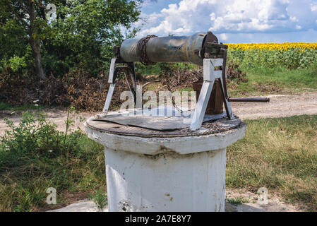 Old well next to rural road in Riscani District of Moldova Stock Photo